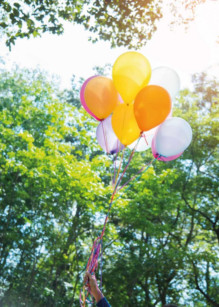 Balloons floating in sky