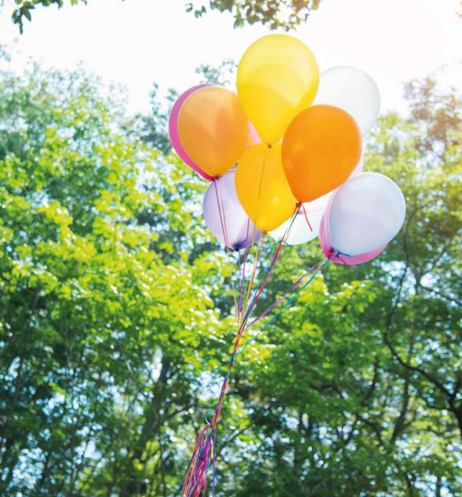 Balloons floating in sky